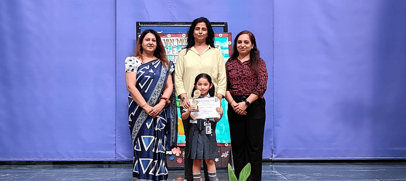 Students displaying her achievement.